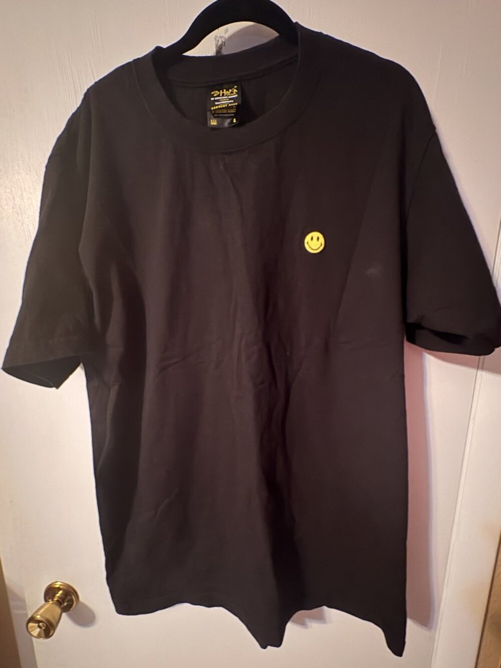 Black tshirt with smile face on left chest